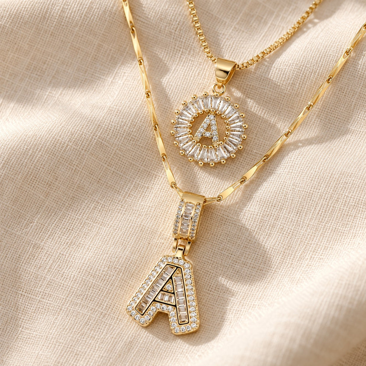 2pc 14k Diamond Letter Initial Necklaces on cream linen