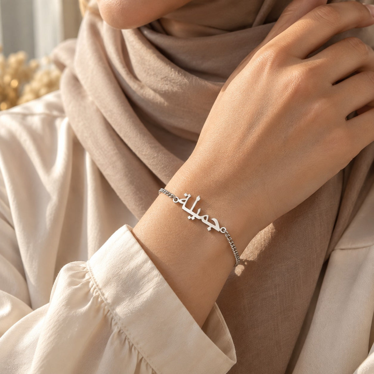 Woman wearing the Custom Name Bracelet in silver