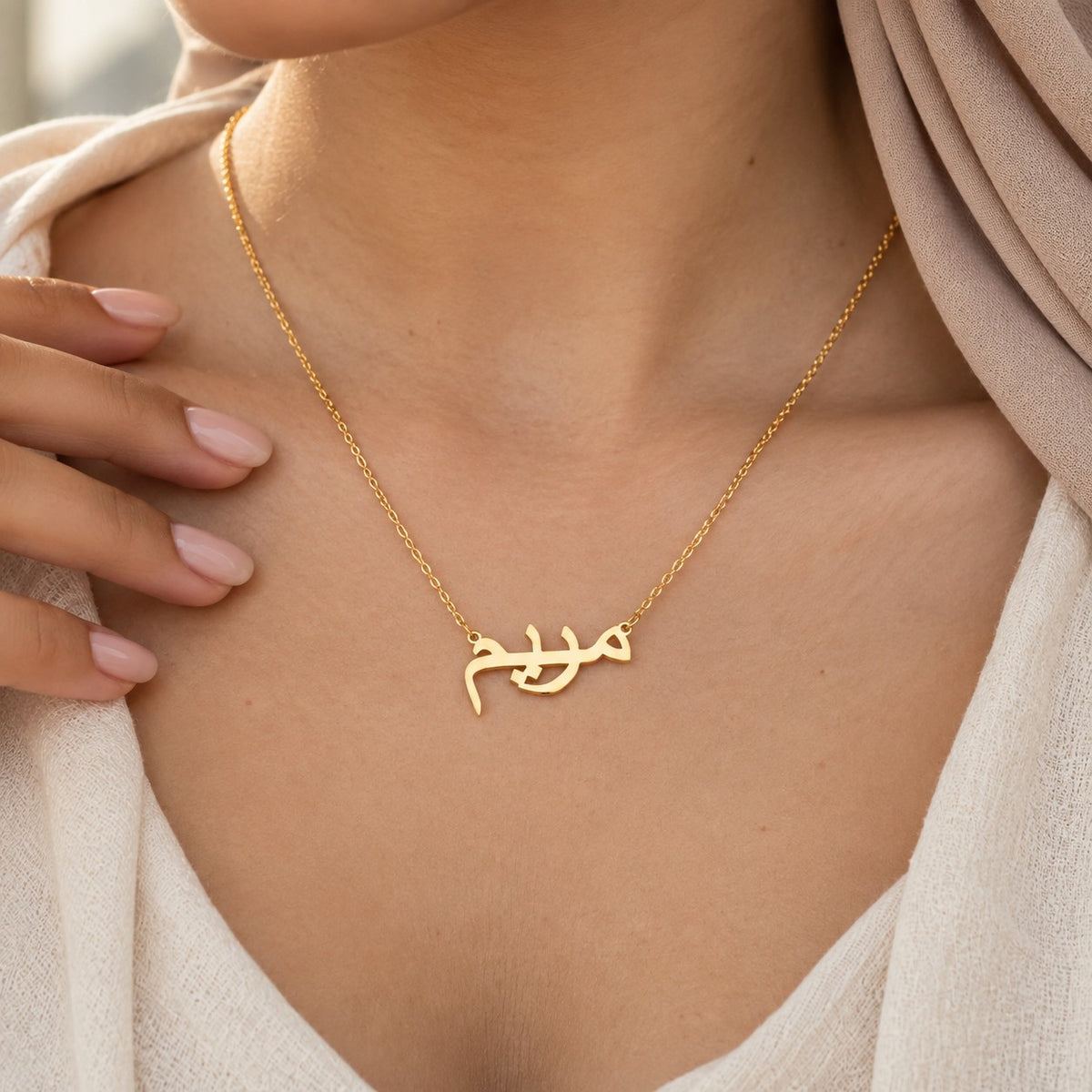 The Custom Name Necklace 18k worn, showing its true size