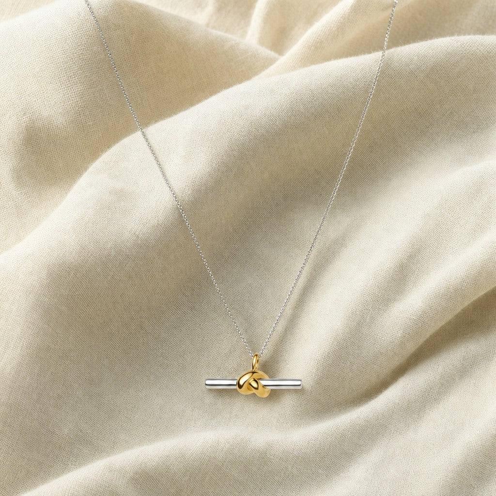 Duality Knot Necklace on cream linen