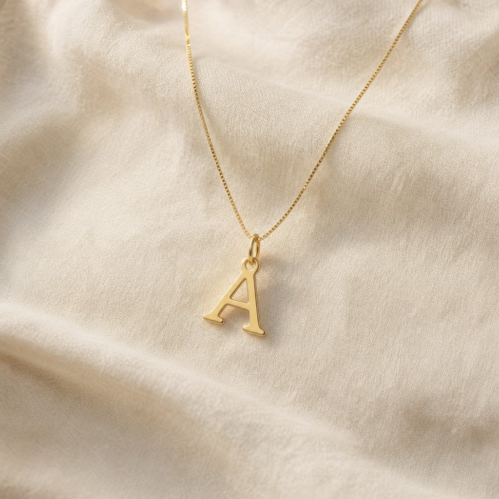 Initial Letter Necklace on cream linen