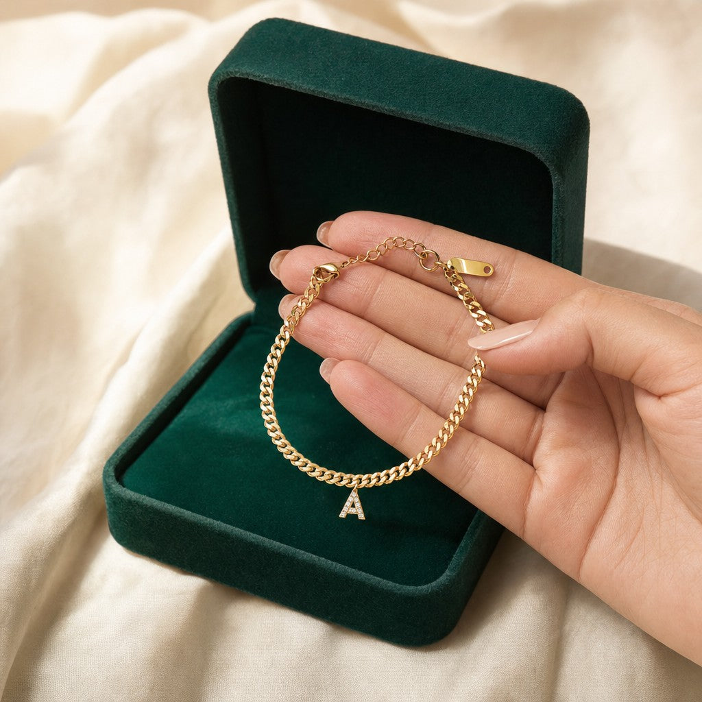 Layali Initial Anklet presented in an emerald velvet gift box
