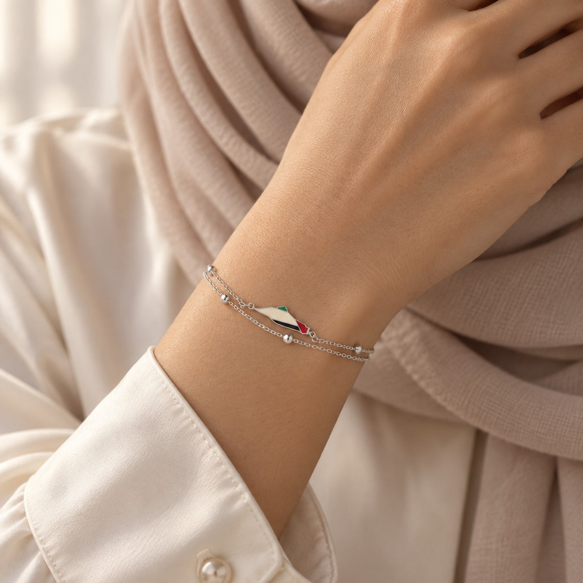 Woman wearing the Palestine Map Bracelet in silver