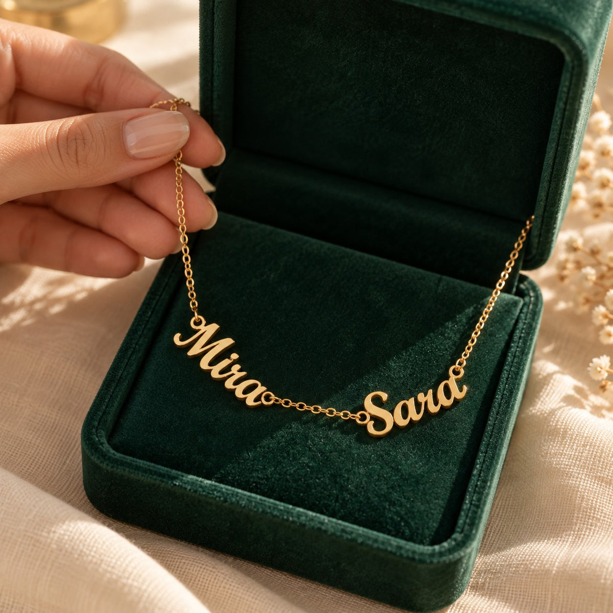 Wasl English Multiple Names Necklace presented in an emerald velvet gift box