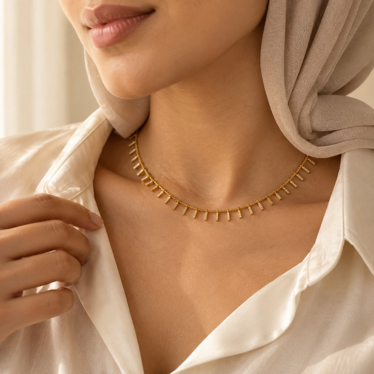 Woman wearing the Zayna Dangle Choker
