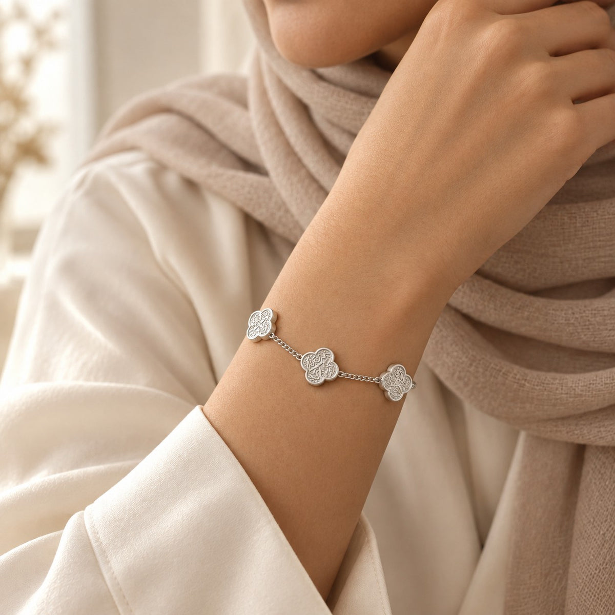 Woman wearing the Rawdat Al Fuad Bracelet in silver