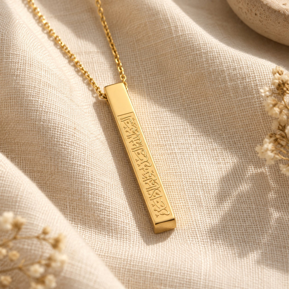 Ayat An Nur Necklace on cream linen