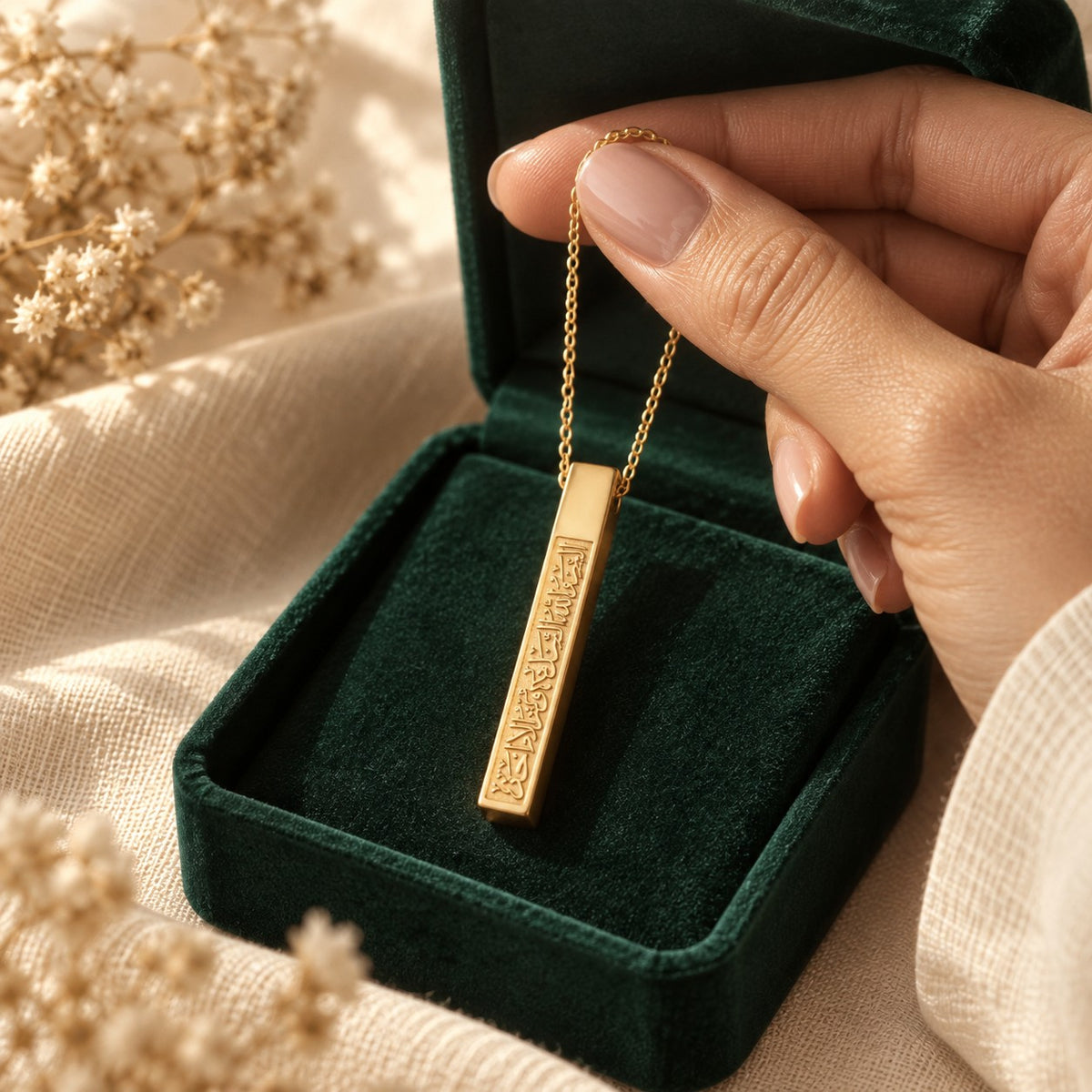 Ayat An Nur Necklace presented in an emerald velvet gift box