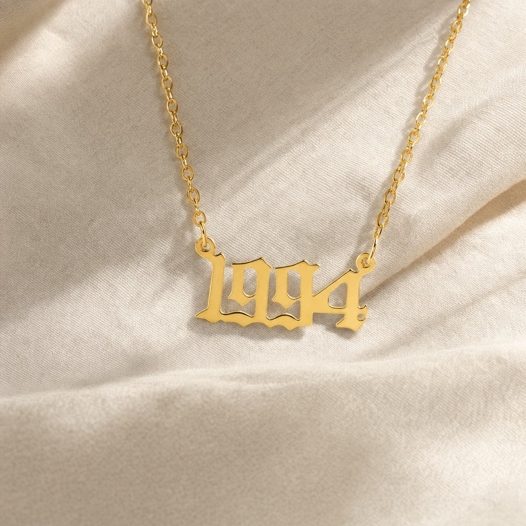 Custom Birth Year Necklace on cream linen