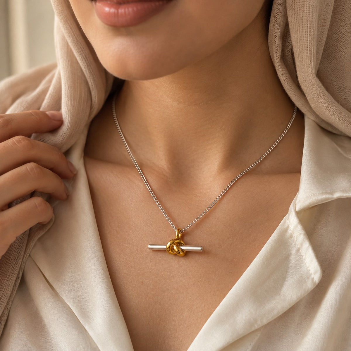 Woman wearing the Duality Knot Necklace