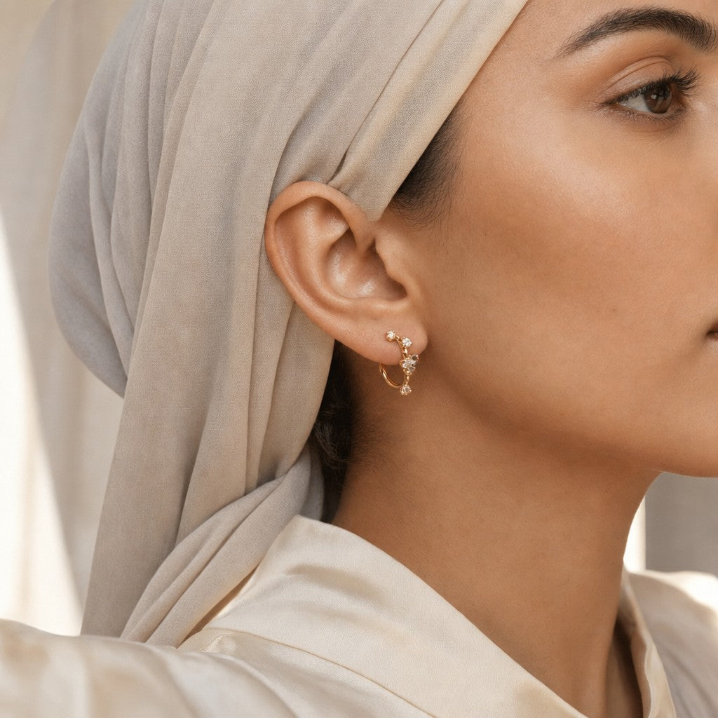 Woman wearing the Najmat Climbers Earrings
