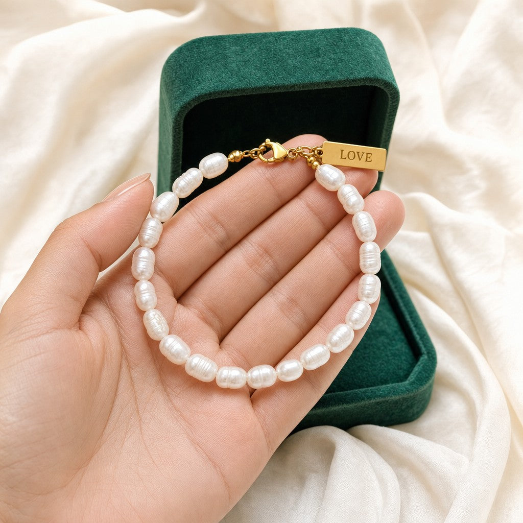 Love Pearl Bracelet presented in an emerald velvet gift box
