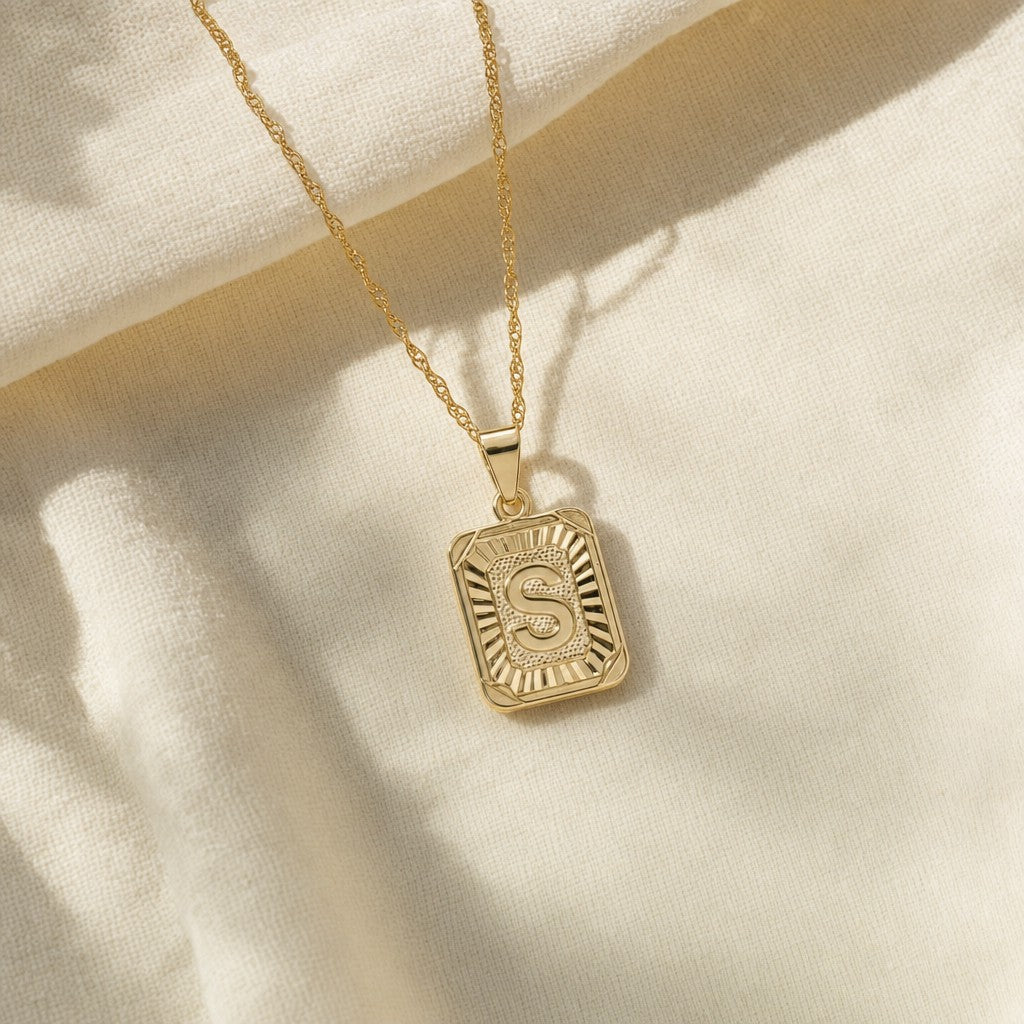 Medallion Initial Necklace on cream linen