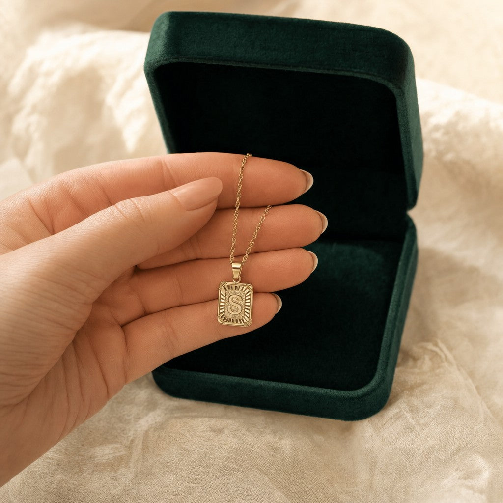 Medallion Initial Necklace presented in an emerald velvet gift box