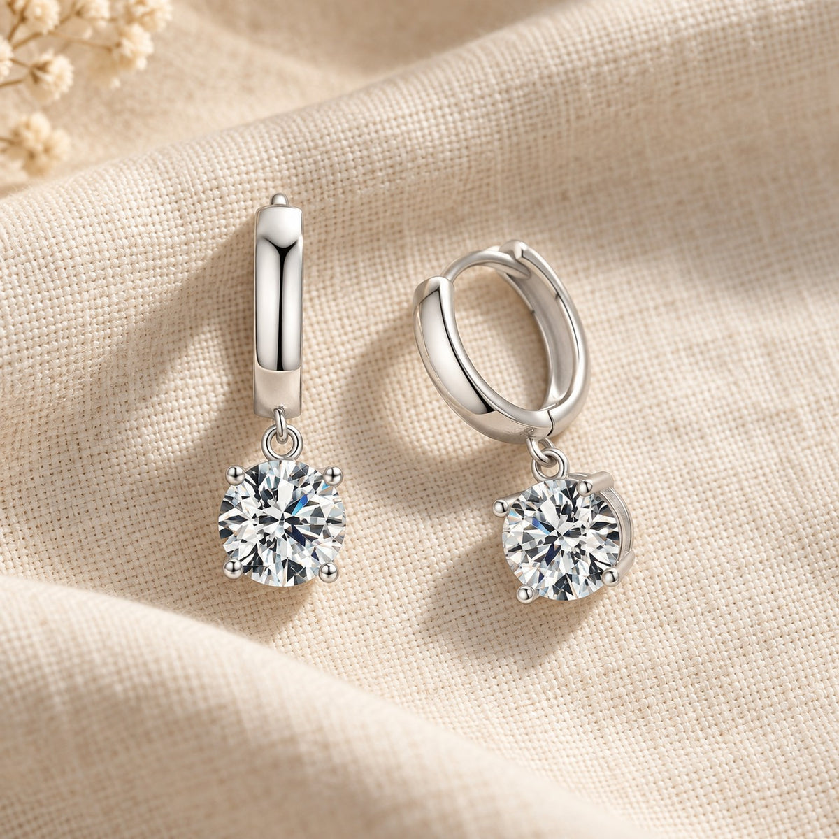 Soraya Moissanite Drop Hoops on cream linen