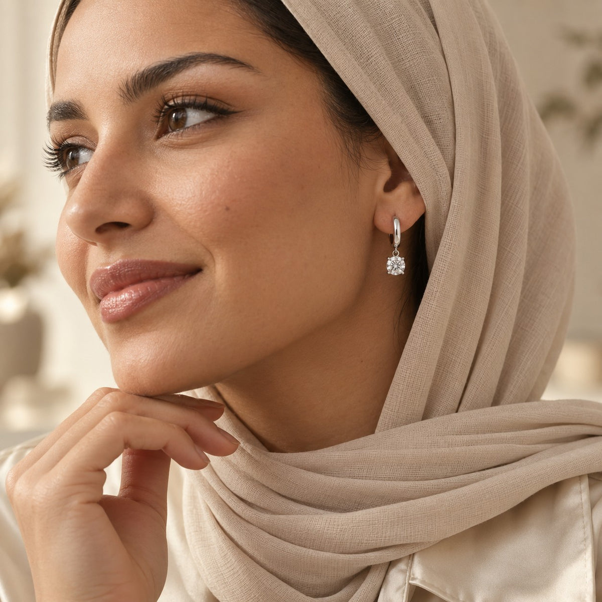 Woman wearing the Soraya Moissanite Drop Hoops
