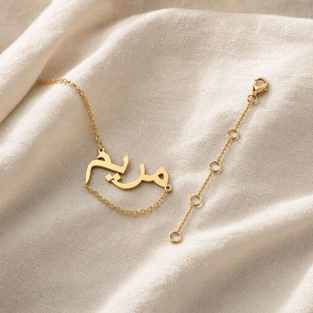Emerald Gift Box + Gold Chain Extender on cream linen