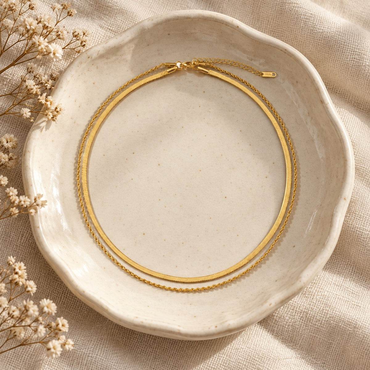 The Luna Chain in a ceramic trinket dish