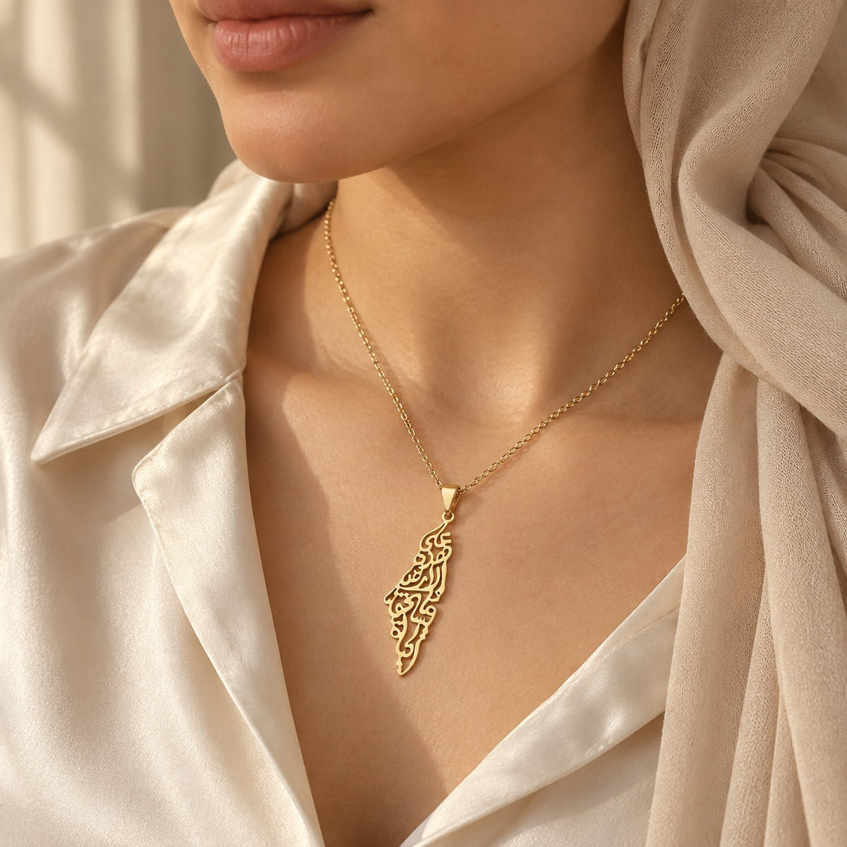 Woman wearing the Palestine Calligraphy Map Necklace