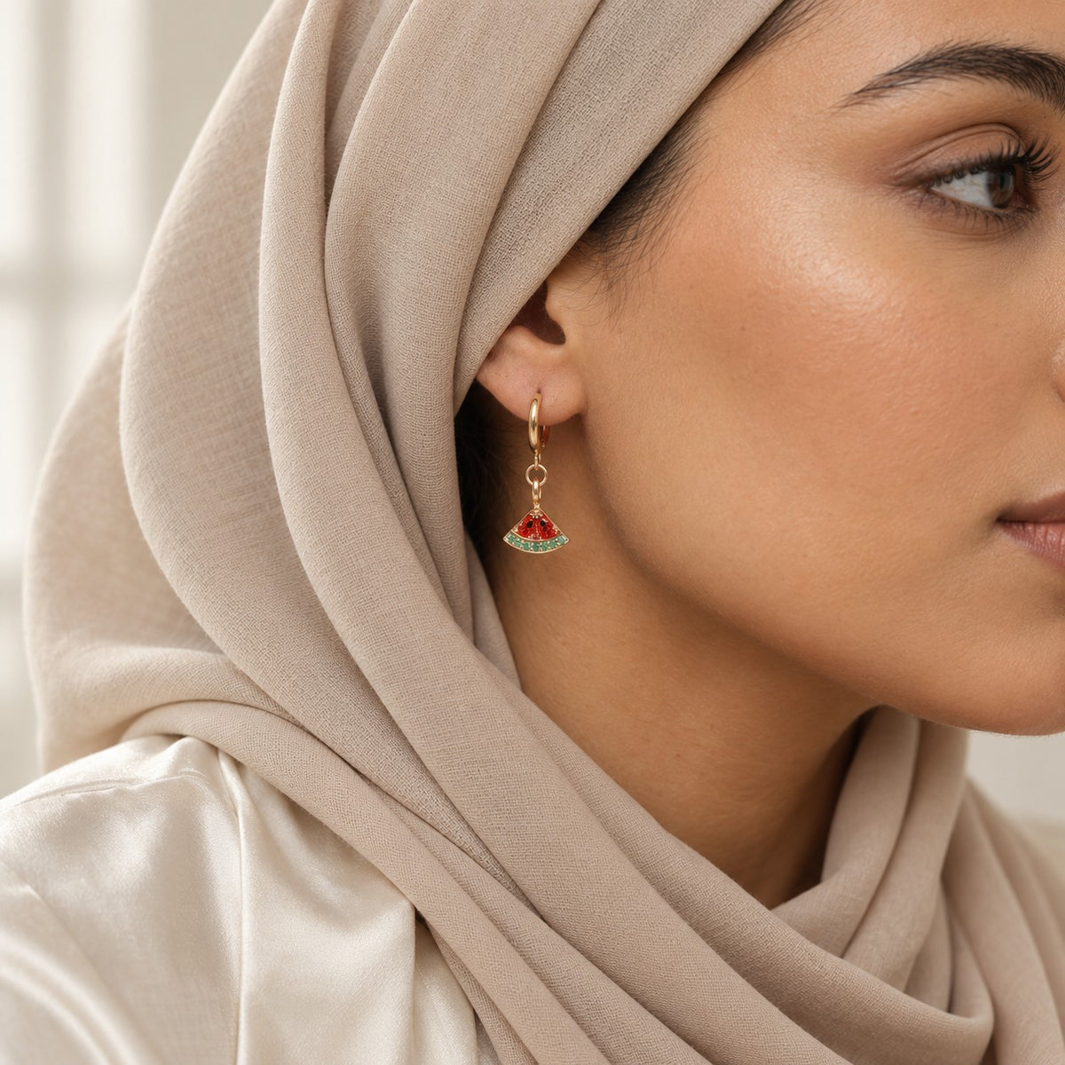 Woman wearing the Palestine Watermelon Hoops