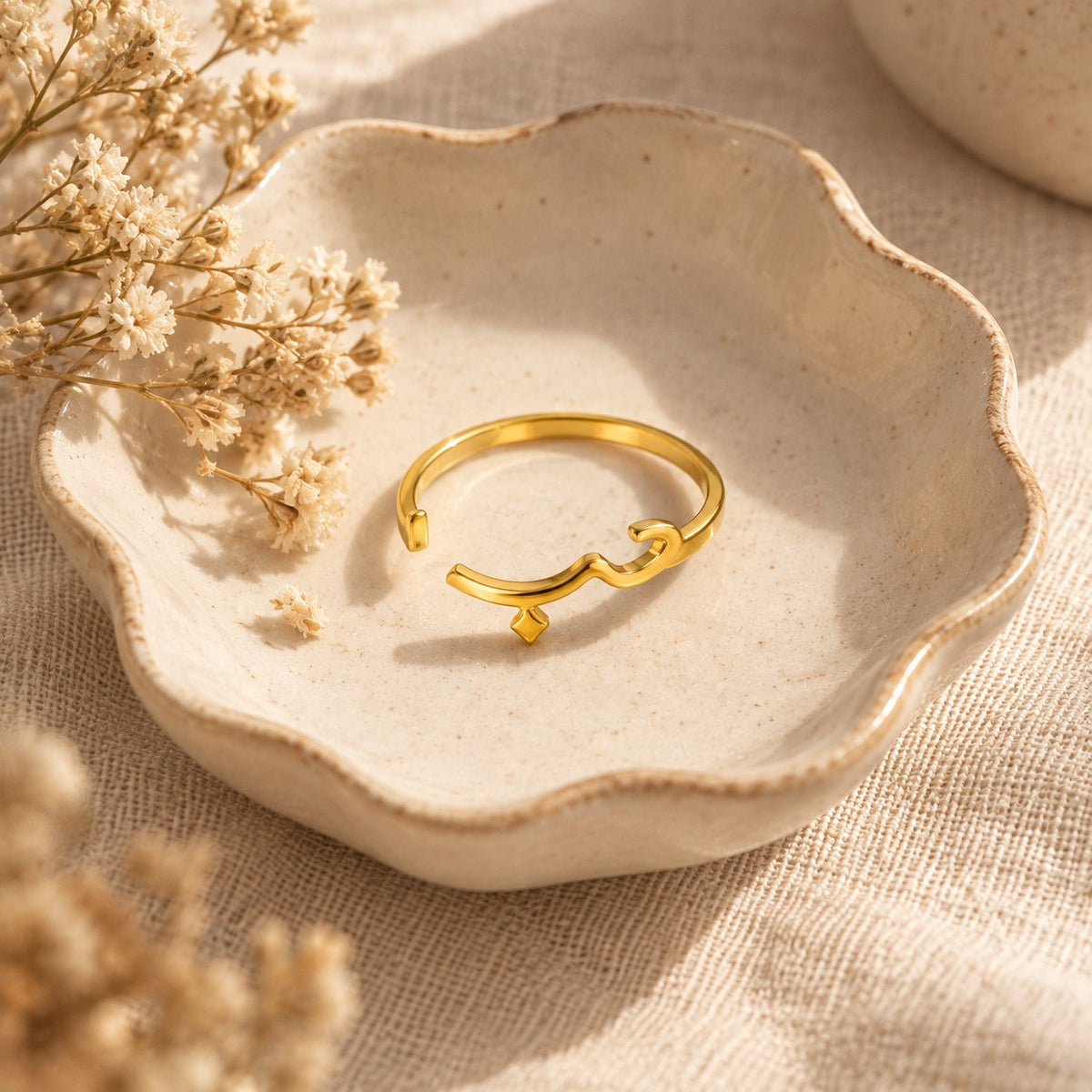 The Arabic Love Ring in a ceramic trinket dish